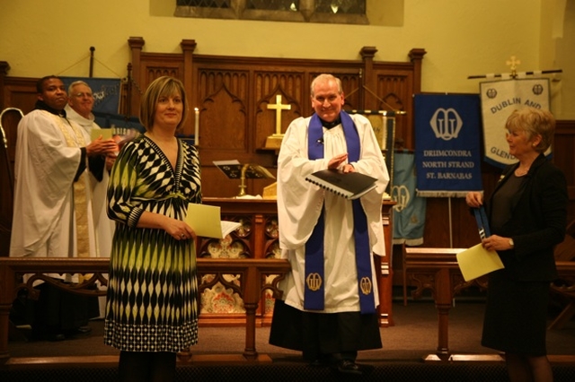 Pictured is the new Mothers' Union Diocesan President Joy Gordon (left) receiving applause at her commissioning in Whitechurch. Also pictured are her predecessor Ann Walsh (right), the Archbishop of Dublin, the Most Revd Dr John Neill and the Revd Obinna Ulogwara, Curate of Whitechurch (left background) and the Revd Paul Houston, Diocesan Chaplain to the Mothers' Union (centre).