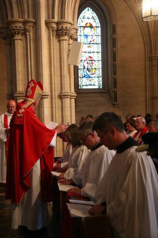 The Archbishop of Dublin, the Most Revd Dr John Neill lays hands on the Revd Terry Lilburn during his ordination to the diaconate in Christ Church Cathedral, Dublin.