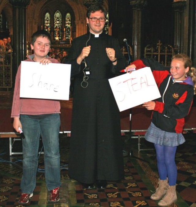 The Revd Stephen Farrell with two helpers during the sermon at the Dublin & Glendalough Diocesan Primary Schools Service