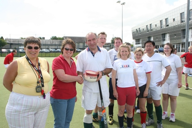 Wicklow team Captain Brian O'Rourke receives the 'potty' for coming last in the  Diocesan Inter Parish hockey Tournament. Also pictured are organisers the Revd Gillian Wharton (left) and beside her, the Revd Anne Taylor.