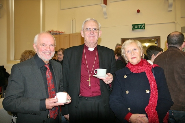 Archbishop John Neill and his wife Betty Neill are pictured with George Walsh, designer of the window, at the reception after the service to dedicate the St Francis stained glass window in Sandford Parish Church. The window is in memory of the Threlfall family. 