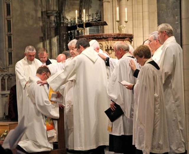The Laying on of Hands during the Service of Ordination of the Revd Eugene Griffin in Christ Church Cathedral.