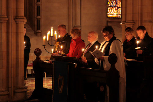 President Michael D. Higgins and his wife Sabina hold their candles in Christ Church Cathedral as part of a service of solidarity for Irish people going through the pain of recession. Pic: David Wynne.