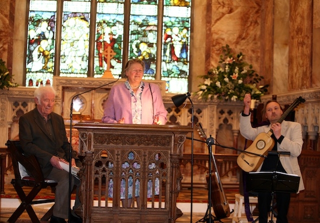 Stella Mew introducing the Nobel Laureate Seamus Heaney and guitarist Eamon Sweeney at the poetry evening 'Blackbird' in Killiskey Parish Church in Nun's Cross, Ashford. 
