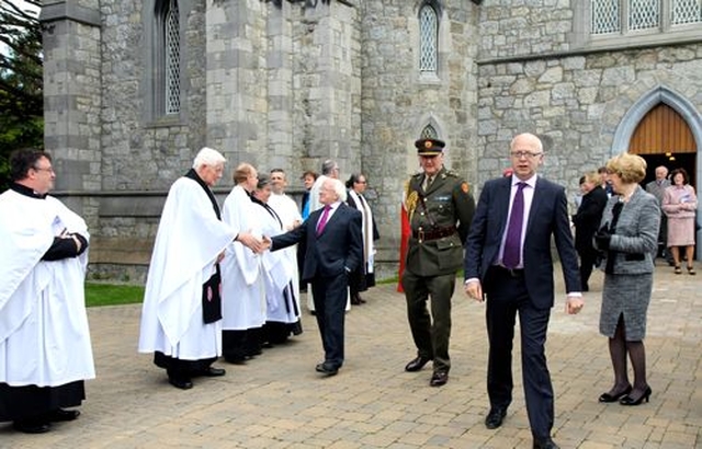 President Michael D Higgins greets clergy outside the Church of St John the Baptist after the service commemorating the 1,000th anniversary of the Battle of Clontarf. 