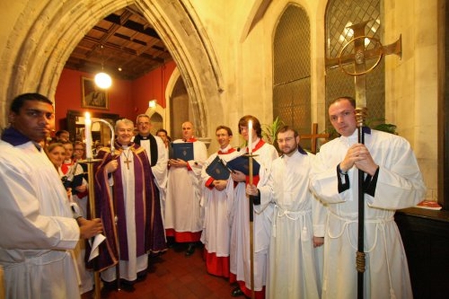 Archbishop Michael Jackson, Dean Dermot Dunne, servers and the choir of Christ Church before entering the cathedral at the Advent Carol Service on 27 November 2011.