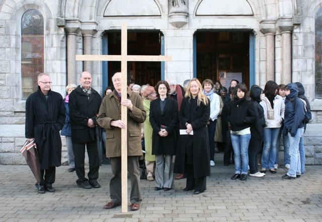 Pictured at the end of the Ecumenical Walk Behind the Cross from the Church of the Holy Name, Beechwood Avenue to Sandford Parish Church. Amongst those pictured is the Revd Anne-Marie O'Farrell (Curate, Sandford and Milltown) and the Revd Sonia Gyles (Rector, Sandford and Milltown) (Photo: David Wynne).