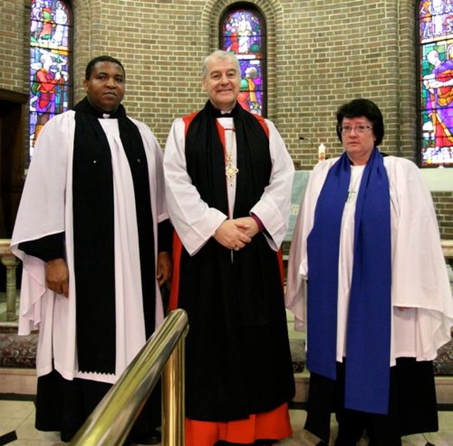 The rector of St George and St Thomas’s Church, the Revd Obinna Ulogwara, Archbishop Michael Jackson and lay reader Gillian Dean at the Discovery International Carol Service on December 8. 