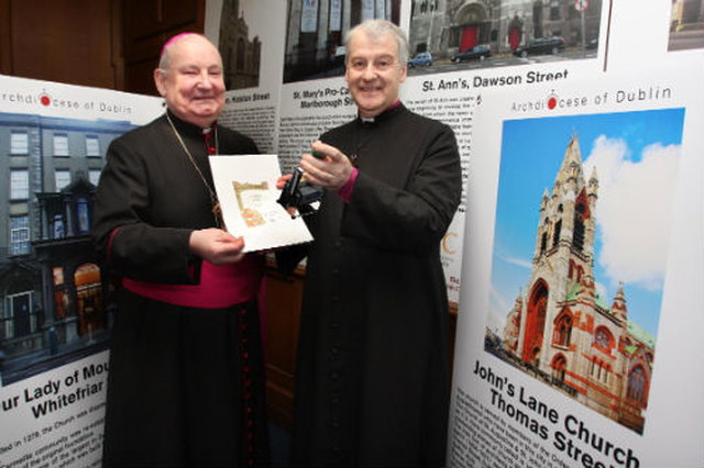 Auxialliary Bishop of Dublin, Ray Field, and Archbishop of Dublin, Dr Michael Jackson, demonstrate the stamp and sample passport to be used by the thousands of pilgrims who will take part in the Pilgrim Walk in June as part of the 50th International Eucharistic Congress. The walk was launched in St Ann’s Dawson Street which is the first stop on the pilgrimage which includes seven Dublin churches (although it can be completed in any order) and the only Anglican church on the route. (Photo: John McElroy)
