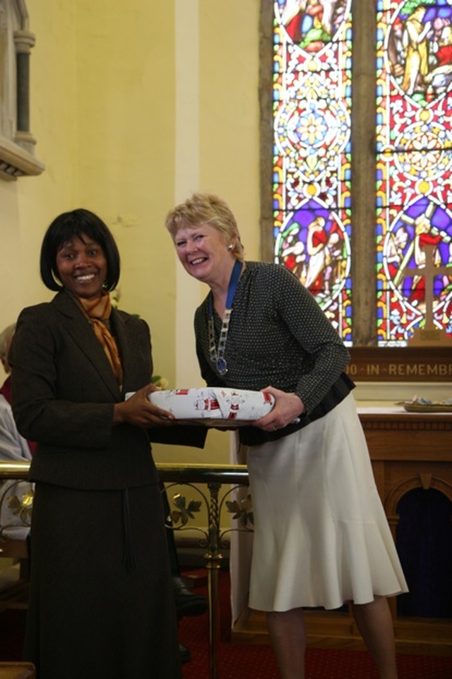 Ann Walsh, Diocesan President of the Mothers' Union receiving a gift from Tina Mutwarasibo after preaching at the Discovery Mothering Sunday Service in St John's Clondalkin.