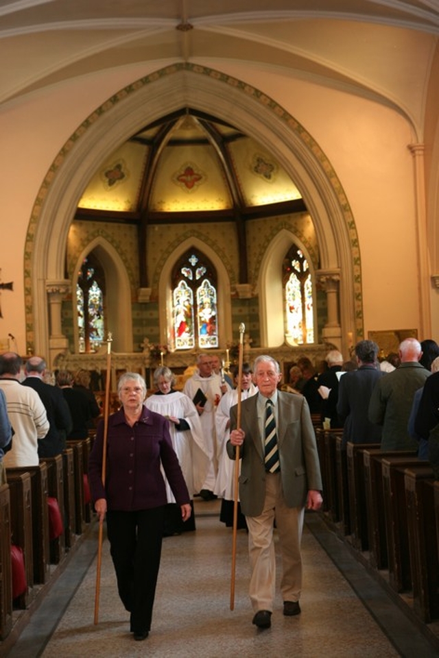 Led by the Churchwardens, the clergy process out of Booterstown Parish Church to the consecration of a new Garden of Remembrance for the parish.