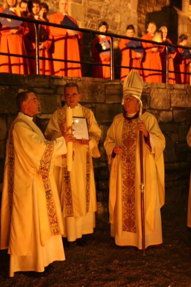 Lighting the Paschal Candle at Easter Vigil in Christ Church Cathedral. Left to right, the Archdeacon of Dublin, the Venerable David Pierpoint, the Dean of Christ Church Cathedral, the Very Revd Dermot Dunne and the Archbishop of Dublin, the Most Revd Dr John Neill.