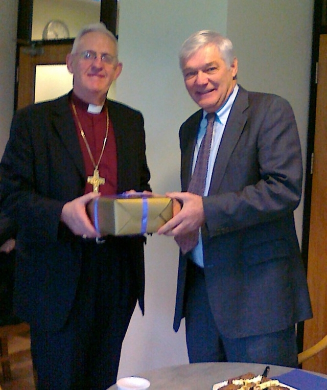 Presentation to Archbishop John Neill by Denis Reardon on behalf of Church of Ireland House. Photo: David Wynne.