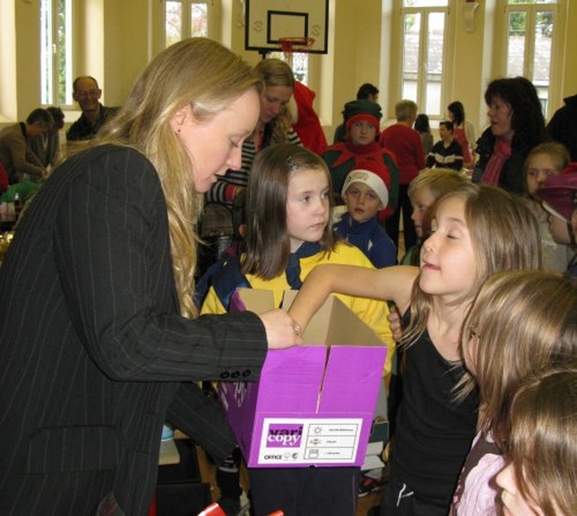 The Revd Sonia Gyles has help to draw the winning raffle ticket at the recent Sandford Parish Christmas Bazaar.