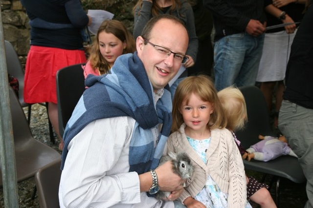 Michael Hamilton and his daughter and 'Nugget' at the Blessing of the Pets Service in Ballinatone, Co Wicklow.