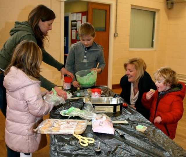 Participants get messy icing buns at a Palm Sunday themed Messy Church in Wicklow. 