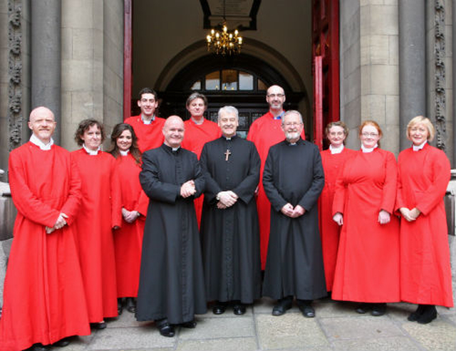 The choir of St Ann’s Church, Dawson Street, with the Archbishop of Dublin, the Most Revd Dr Micheal Jackson, and the Vicar and Curate of St Ann’s, Revd David Gillespie and Rev Martin O’Connor following the three–hour Good Friday service in the church. 