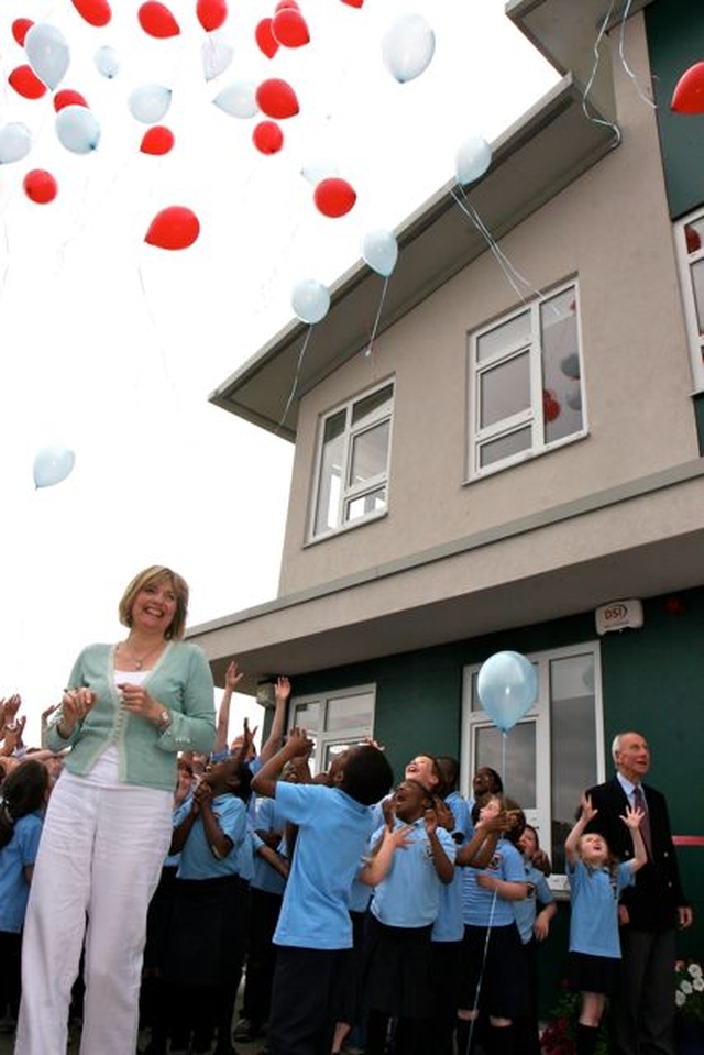 There is huge excitement as the children let go their balloons at the official opening and blessing of Athy Model School. School principal, Yvonne Griffin, joins in the fun.
