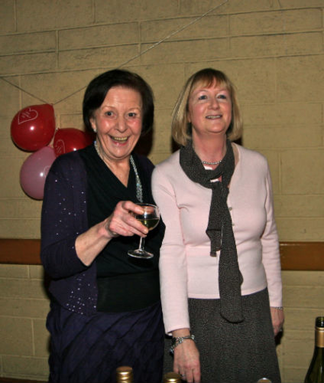 Vi Hoffnan and Denise Richards man the bar at the Booterstown Parish Valentine’s Supper Dance in aid of the Raise the Roof fund. 