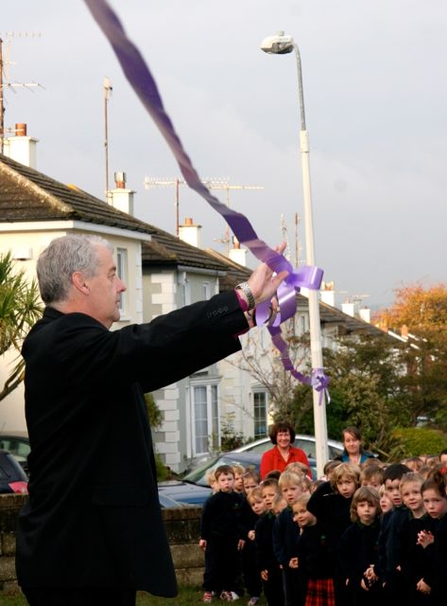 Archbishop Michael Jackson cuts the ribbon officially opening Glenageary Killiney National School’s new outdoor classroom. 