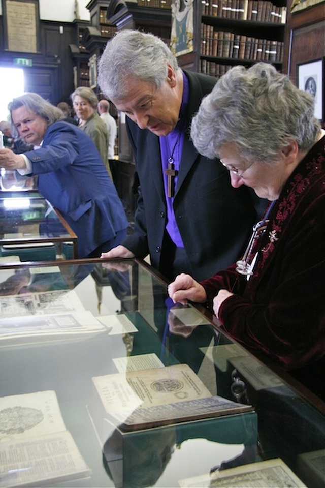 Muriel McCarthy, keeper, showing the Most Revd Dr Michael Jackson, Archbishop of Dublin, the collection of Bibles in a new exhibition in Marsh's Library, Dublin.