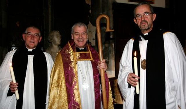 Archdeacon David Pierpoint, Archbishop Michael Jackson and Dean Dermot Dunne preparing for the Advent Procession in Christ Church Cathedral. 