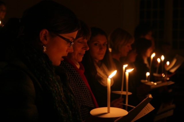 Pictured are worshipers at a candlelit carol service in Christ Church, Taney.