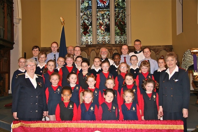 Members of the 6th RI Company of the Girls’ Brigade, including Captain Isobel Henderson (far left, front row), pictured at the Palm Sunday service of thanksgiving for the company's centenary in Holy Trinity Church, Rathmines.