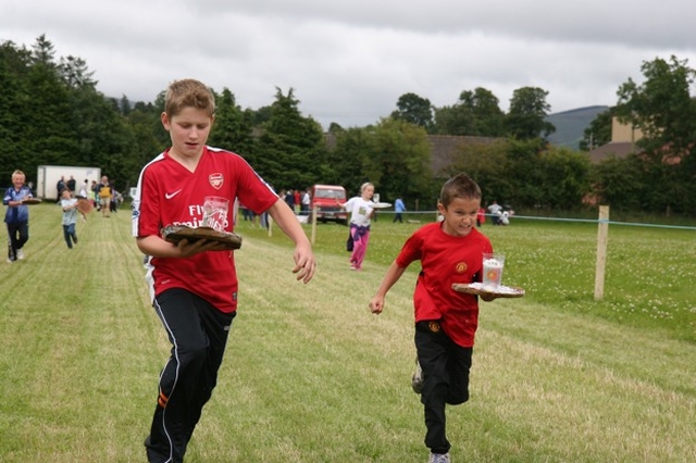Arsenal just edge out Manchester United at one of the waiters races at a parish fete and race day in County Wicklow.