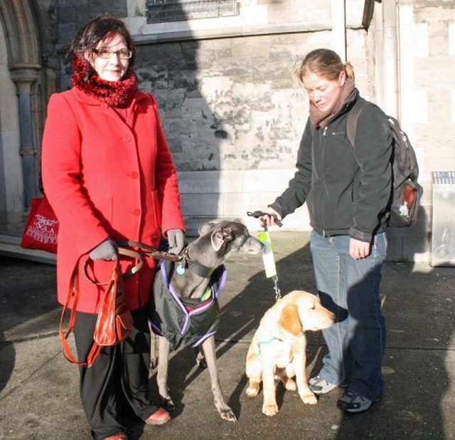 Annie Doran with Blue and Emma Higgs with Guinness at the Christ Church Cathedral Charity Carol Service in aid of Peata – Providing a Pet Therapy Service to caring institutions in Dublin.