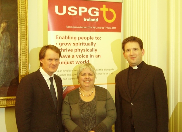 Pictured at the launch of the photographic exhibition 'Living Positively with HIV/AIDS' in the Gallery Chapel, Trinity College Dublin, were Peter Power TD, Minister of State for Overseas Development; Linda Chambers, Director of USPG Ireland; and the Revd Darren McCallig, Dean of Residence at TCD. Photo: Trinity Chaplaincy. 