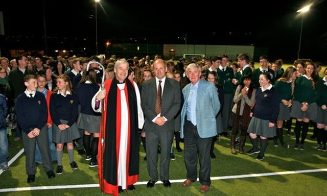Archbishop Michael Jackson, Principal of East Glendalough School, Alan Cox and chairman of the board of management, Geoffrey Perrin, with the gathered crowd on the school’s state of the art new hockey pitch. 