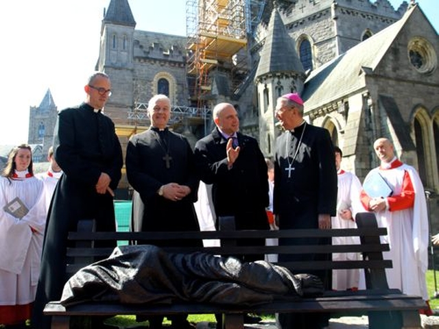 Dean Dermot Dunne, Archbishop Michael Jackson, sculptor Tim Schmalz and Archbishop Diarmuid Martin with the Christ Church Cathedral Choir at the blessing of the Homeless Jesus sculpture.