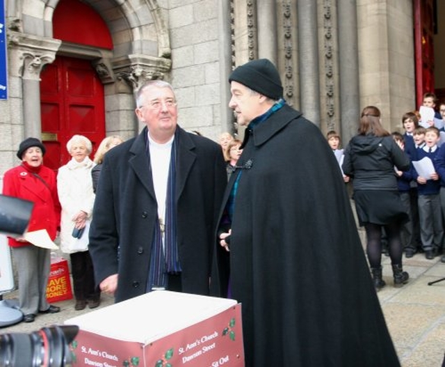 Archbishop Diarmuid Martin and Archbishop Michael Jackson chat before collecting for charity during the Black Santa Appeal outside St Ann’s Church on Dawson Street. 