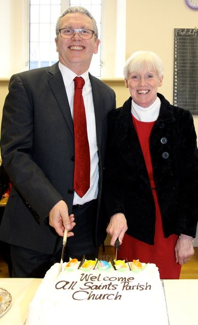 Newly commissioned Diocesan Readers, David Reynolds and Helen Gorman, cut a celebratory cake. 