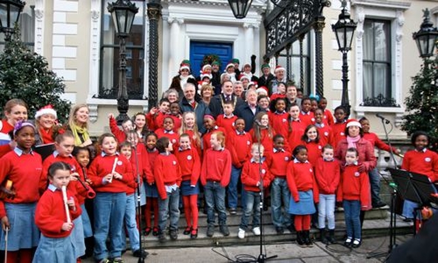 Organisers and readers at the Community Carol Singing at the Mansion House Dublin gather on the steps with the choir of St Ultan’s School, Cherry Orchard and the Cherry Orchard Community Singers. The readers included the Lord Mayor of Dublin, Naoise Ó Muirí, Paddy Moloney of the Chieftans, Ronan Johnson of Spirit Radio and Diocesan President of the Mothers’ Union Joy Gordon. Also pictured are the Revd Ken Rue, Geoffrey McMaster and Gerard Gallagher of the organising committee. 