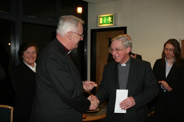 The Archbishop of Dublin, the Most Revd Dr John Neill making a presentation to the Revd Canon John McCullagh at a reception in his honour in recognition of his work as General Synod Education officer (Republic of Ireland) which he left recently to become Rector of Rathdrum.