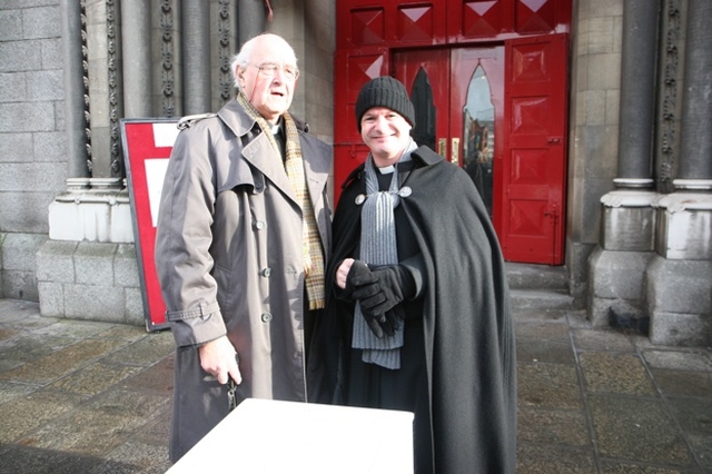 The Very Revd Cecil Faull, former Dean of Leighlin (left) lending moral support to the Revd David Gillespie, Vicar of St Ann's (aka Black Santa) as he resumes his sit out in aid of the Haiti Earthquake Appeal.