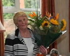 Tess Breach, with flowers presented to her at a retirement party in her honour after she retired after 19 years service in St Mary's home, Pembroke Park.