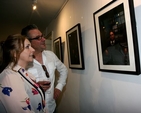 Singer Moya Brennan and Tim Jarvis admire the photographic portraits in the first exhibition to take place in the new St Michan’s community art gallery. 