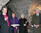 The Most Revd Dr Katherine Jefferts Schori pictured with her copy of Christ Church Cathedral Dublin: A History, as author Dr Kenneth Milne looks on. 