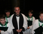 The Revd Andrew McCroskerry with choiristers that received RSCM (Royal School of Church Music) Awards in Christ Church Cathedral.