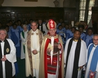 Pictured are some of the clergy at the Diocesan Discovery 5th Anniversary Thanksgiving Service in Christ Church Cathedral (left to right) the Revd Canon Horace McKinley, the Revd Canon Katharine Poulton (background), the Very Revd Dermot Dunne, Dean of Christ Church, the Very Revd Patrick Towers, Former Provost of St Nicholas Collegiate, Galway (preacher, background), the Archbishop of Dublin, the Most Revd Dr John Neill, the Revd Obinna Ulogwara, Diocesan Chaplain to the International Community and Canon Ken Rue (lay Reader). In the background are members of the National Choir of the Redeemed Christian Church of God who were one of the four choirs who sang at the service.