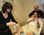 Ordinand in the Church of Ireland Theological Institute Colin McConaghie gets his legs waxed for charity (Bishop's Appeal). Offering moral support is fellow ordinand Jim Caldwell.