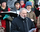 Father Kevin Doran, Secretary General International Eucharistic Congress 2012, reads a lesson at the community carol singing at the Mansion House.