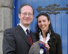 Former Organist and Master of Choristers in St Patrick's Cathedral Choir School Peter Barley and his wife Christine with a presentation made to him by members of the Schools' Parent Teacher Association.