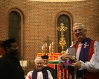 The Archbishop of Dublin, the Most Revd Dr John Neill receives a gift of a new Pectoral Cross from Fr Koshy Vaidyan of the Indian Orthodox Church at their Ecumenical Service in St George and St Thomas. The Church of St George and St Thomas is shared between the Church of Ireland and the Indian Orthodox Church. In the background are the Revd Canon Katharine Poulton and Fr Godfrey O'Donnell of the Romanian Orthodox Church.