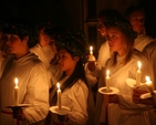 Members of Adolf Fredrik's Youth Choir , Stockholm about to process at the Sankta Lucia celebration in Christ Church Cathedral.