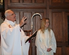 The Revd Sonia Gyles, Rector, is pictured beside Archbishop John Neill as he blesses the St Francis stained glass window in Sandford Parish Church. 