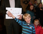 David Bremner, former organist with Sandford parish, receiving a Thank You card from the local Sunday School. Photo: David Wynne